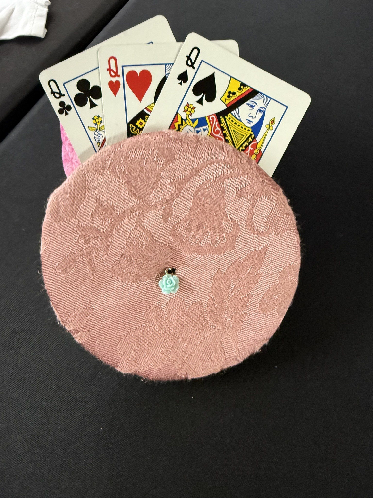 muted pink playing cards holder with turquoise rose charm