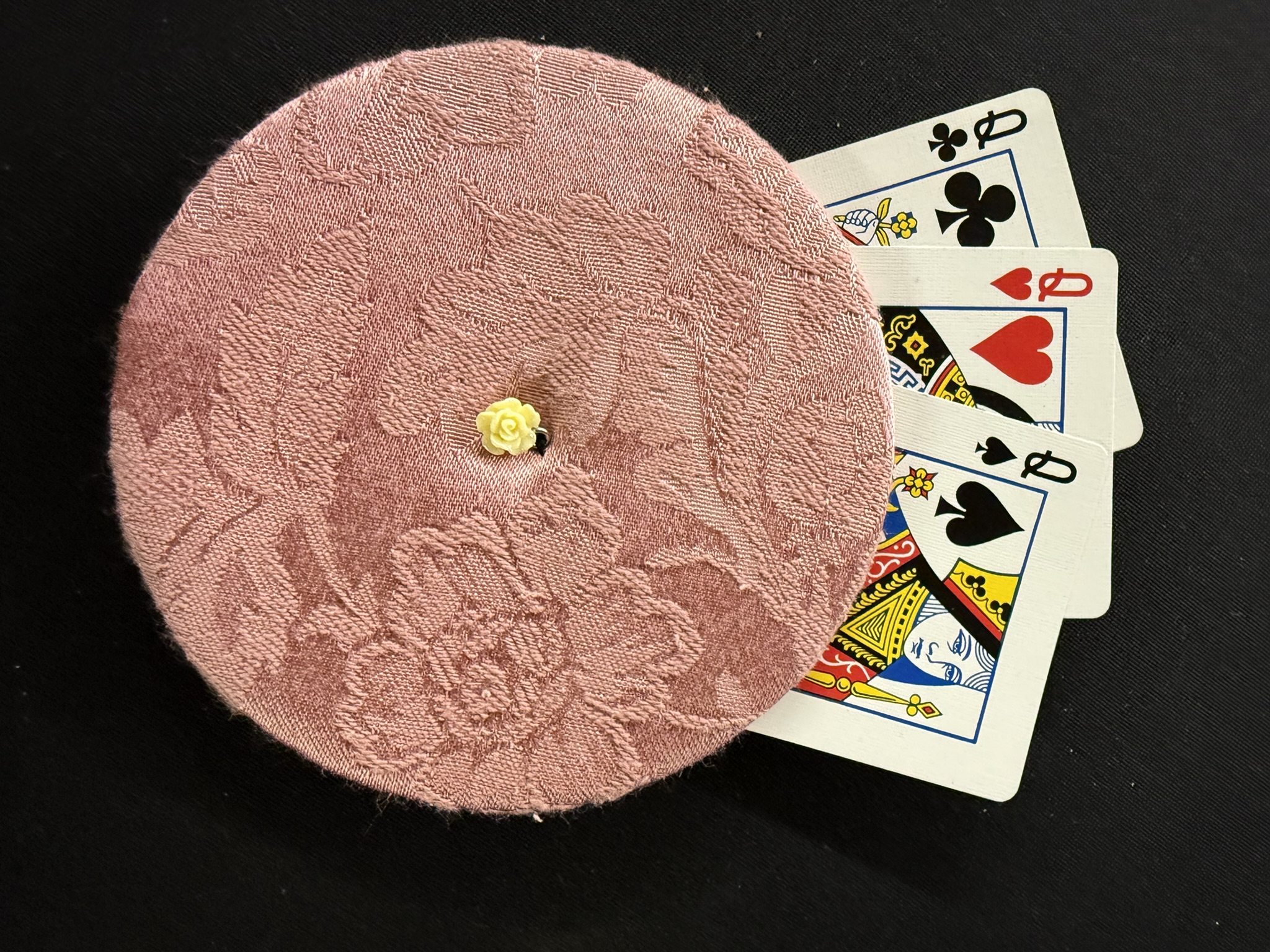 muted pink playing cards holder with yellow rose charm