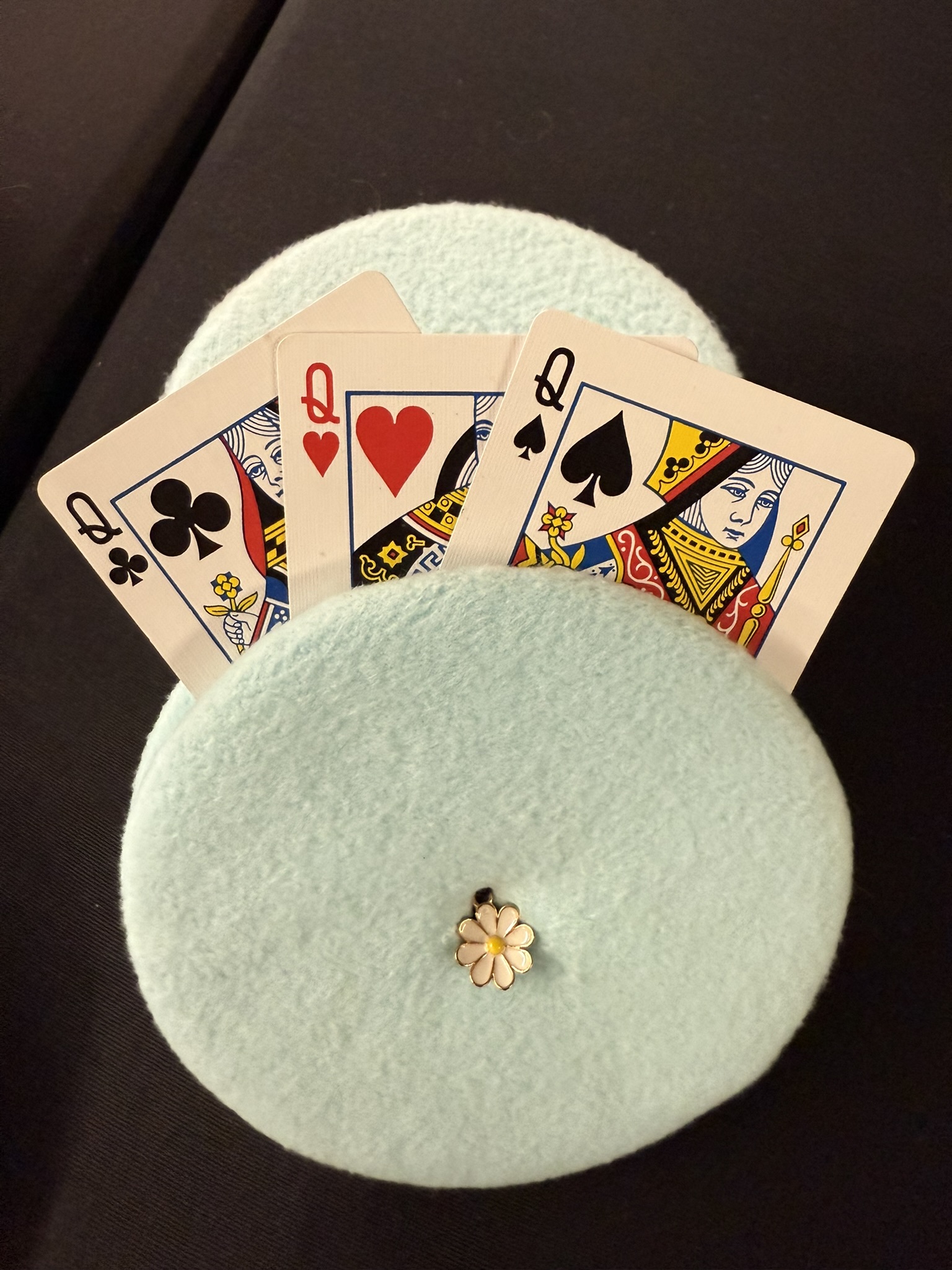 turquoise playing cards holder with white flower charm