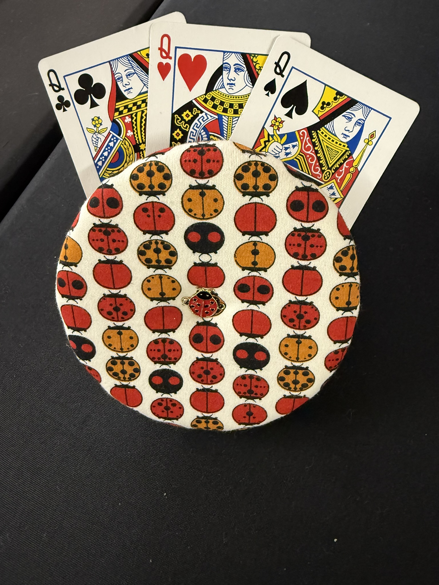 ladybug playing cards holder with a ladybug charm