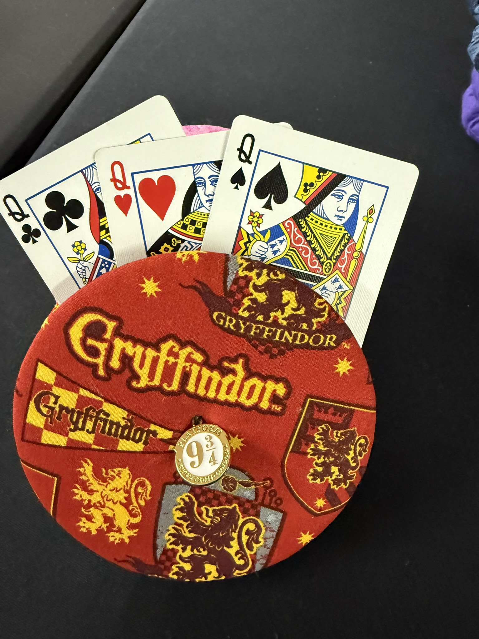 Gryffindor themed playing cards holder with 9 3/4 charm