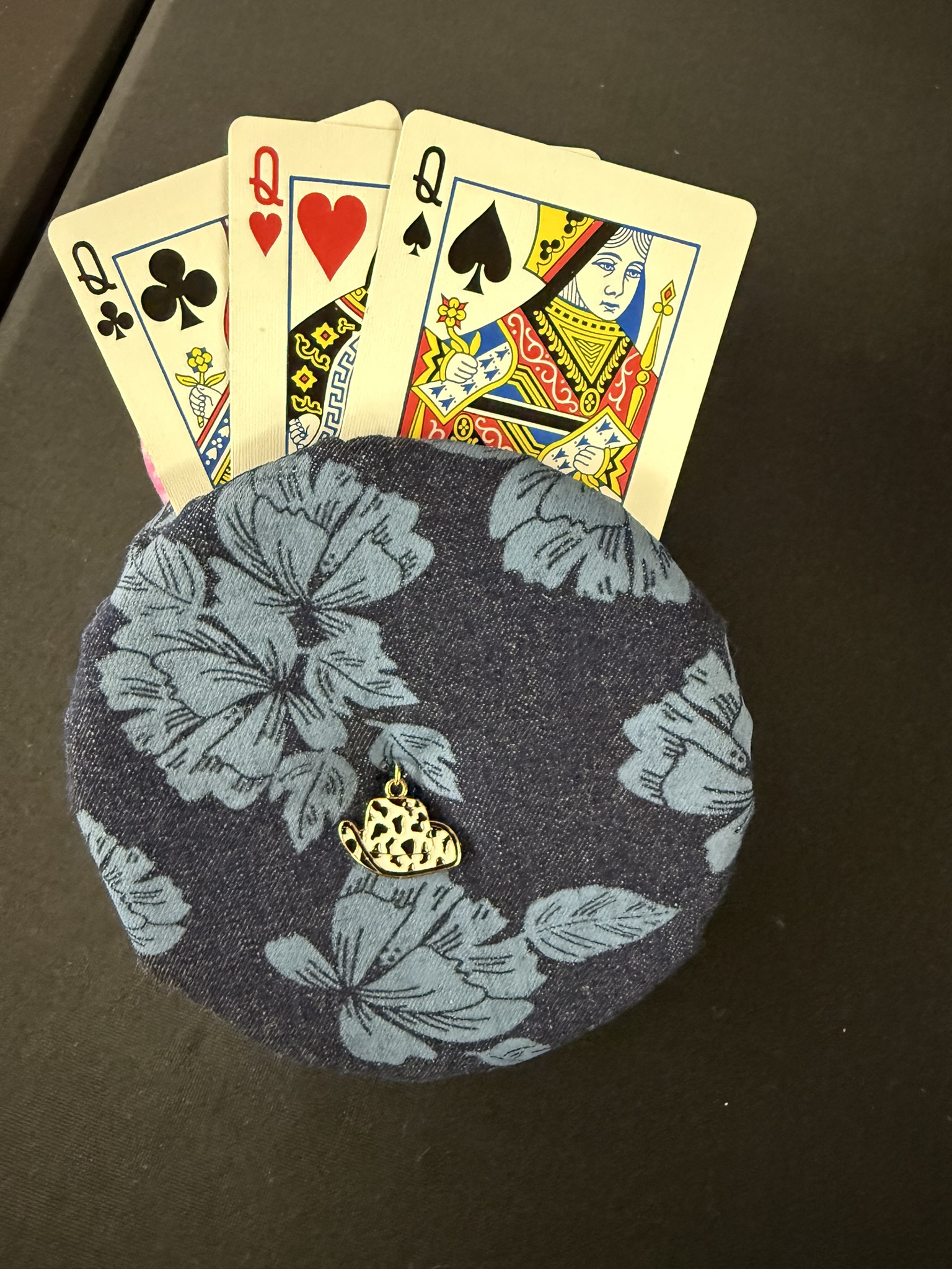 blue floral playing cards holder with black and white cowboy hat charm